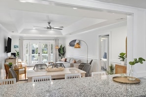 Large kitchen peninsula opening up to the dining and living area