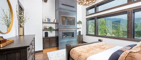 The master suite is a luxurious space to relax in - take in the mountain views as you enjoy your private fireplace.