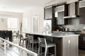 Bar-style seating (The coffee maker is drip only - no Nespresso or Keurig available for use)