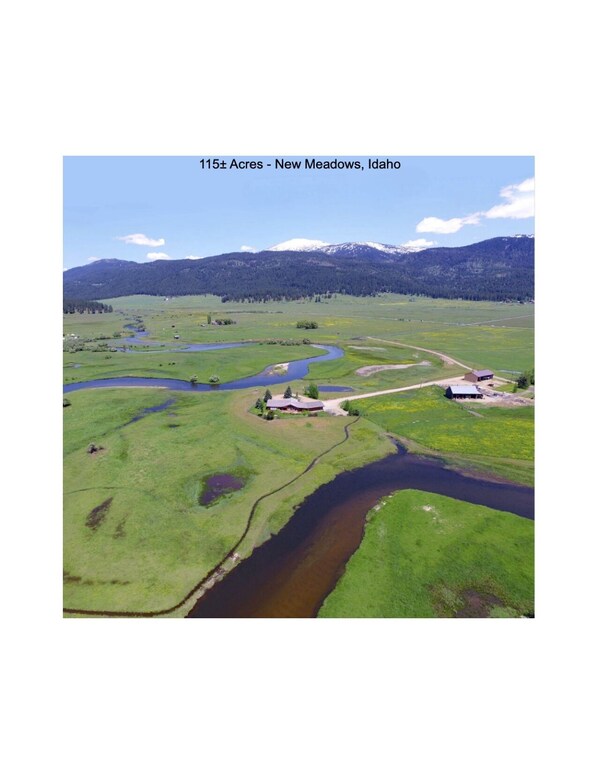 115 acres with 4000lf of Little Salmon running through it and Natural hotsprings