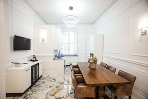 View of the kitchen from the entry door which includes all top appliances.