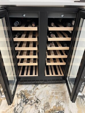 Wine refrigerator so guests who are staying longer can keep their wine properly