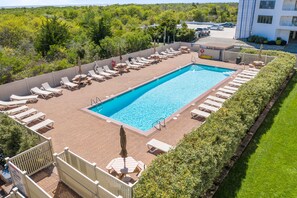 Community pool open seasonally right next to the dunes.