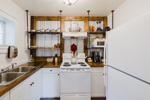 Prepare your meals in a kitchen that blends industrial design with cozy comfort