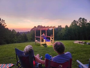 Our stage with the sun setting behind it