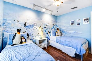 Penguins themed room with two twin beds