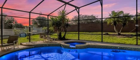 Patio pool deck with outdoor dining and seating and large private fenced backyard