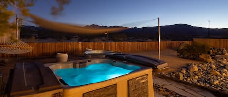 Soak in the hot tub under the stars