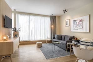 Living area. Exact unit will be assigned upon arrival. Views, colors, and decor may vary.