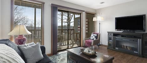 Floor-to-ceiling sliding glass doors in the living area