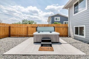 Hot tub in fenced yard