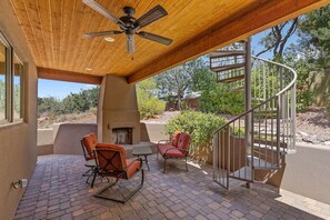 Relax in the shade on the lower level patio, with its own wood burnin fireplace, or take the circular staircase up to the observation deck!