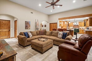 Warm wood accents and beautiful tiled floors define the Great Room.