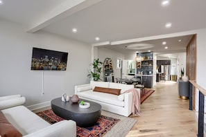 Open-concept living area with dining room and minibar.