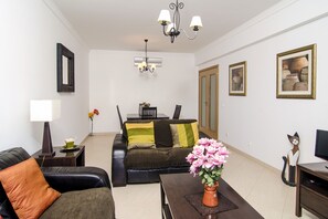 Living room with two leather sofas and dining table