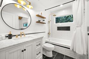 Modern farmhouse inspired bathroom design. Dual shower head & bathtub. 