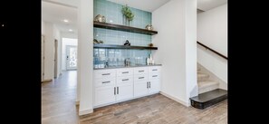 Wet Bar.  Extra linens in lower cabinets