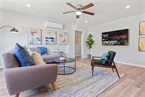 Spacious living room with 65" Smart Roku TV