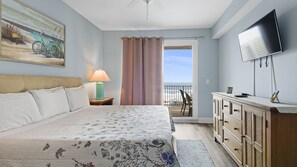 Primary Bedroom with ocean views, King Size Bed, Flat Screen TV, Ensuite Bathroom and Private Balcony Access