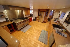 Bright and luxurious kitchen with a perfect blend of functionality and style, creating the heart of your cozy getaway.