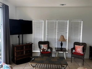 Large open-space living area with 4k 65" smart TV with streaming apps & live TV