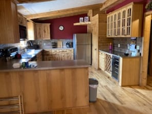 The kitchen is completely equipped including a beverage refrigerator