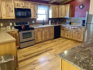 Huge gourmet kitchen with stainless steel appliances
