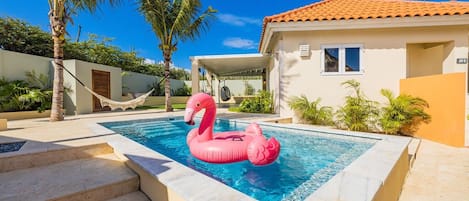 This private pool with a hammock by the pool is a dreamy setting for everyone 