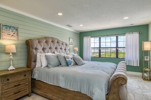 The river view master bedroom is outfitted with a king sized bed and luxury bath and linens.