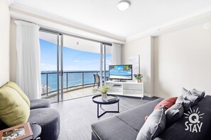 Living room overlooking the ocean and the city 