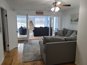 Living Room with Sun Room in the Background