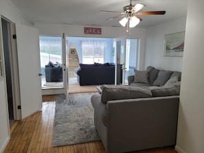 Living Room with Sun Room in the Background