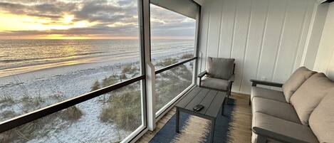 Beach and gulf view from screened in porch.