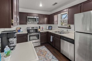 Create culinary delights in our fully equipped kitchen, complete with modern appliances and charming details for a home-cooked meal away from home.