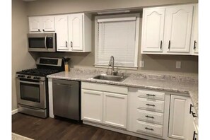 Fully equipped kitchen for cooking and baking.
