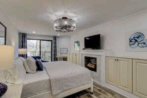 Master Bedroom w electric fireplace and dedicated workspace