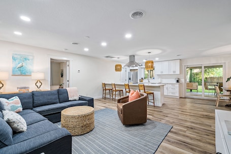 Open concept living and dining area with easy access to outdoor living area.