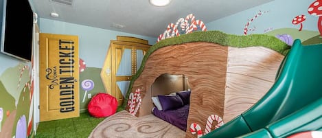 A playful bedroom featuring an exciting slide, creating a unique and adventurous space for relaxation and fun.