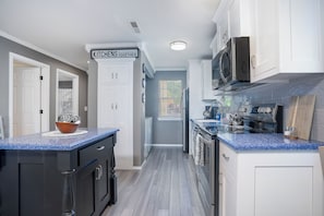 Whip up a delicious meal in our fully stocked kitchen - the heart of our cozy condo that's sure to inspire your inner chef!
