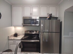 Kitchen area with stainless steel appliances.