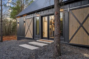 Front of cabin with functional barn doors for guest privacy 