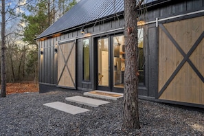 Front of cabin with functional barn doors for guest privacy