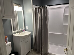 Roomy Bathroom with large walk in shower and waterfall showerhead