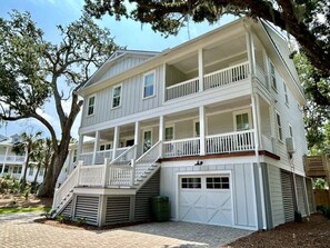 111 Forest Trail, Isle of Palms, South Carolina welcomes visitors with a beautiful exterior and private pool!