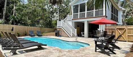 111 Forest Trail, Isle of Palms, South Carolina welcomes visitors with a beautiful exterior and private pool!