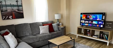 Comfortable living room which includes the usage of 55” smart tv