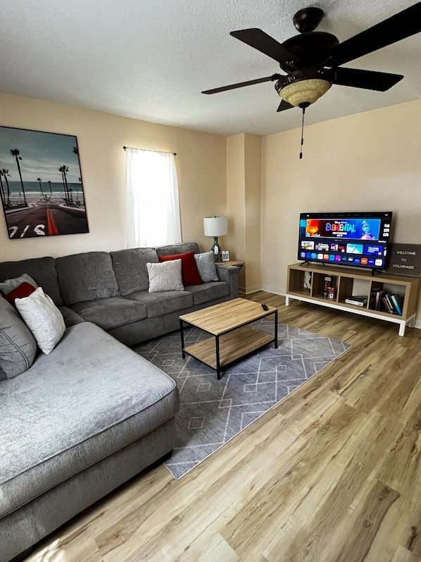 Comfortable living room which includes the usage of 55” smart tv