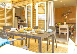 A welcoming dining setup on the deck, perfect for alfresco meals with friends and family.
