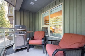 Rear patio overlooking the forest, perfect for a morning coffee or evening BBQ.