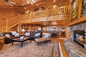 Leather Furniture, Gas Log Fireplace and Floor to Ceiling Wood